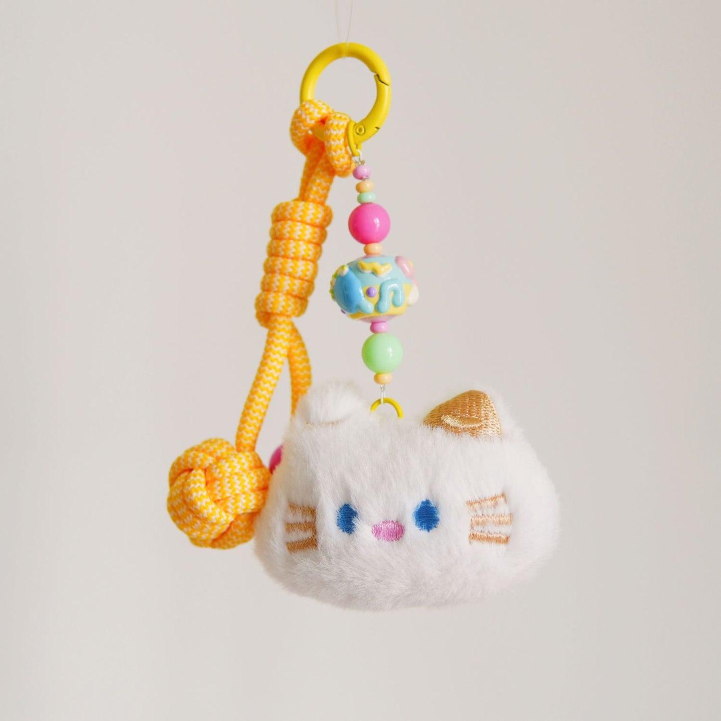 White Kitty Yellow Squeaky Charm