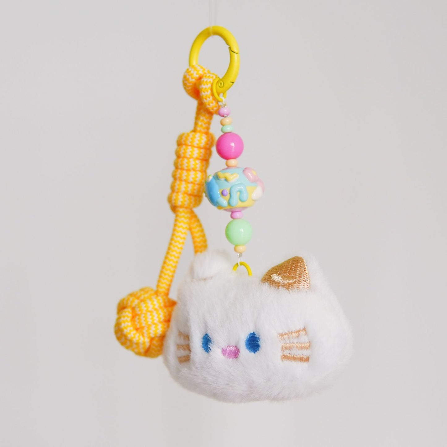 White Kitty Yellow Squeaky Charm