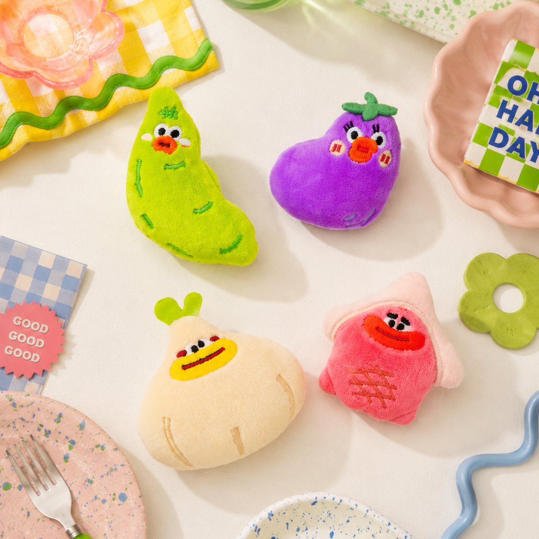 Colorful vegetable brooches on a table with a fork and grapes